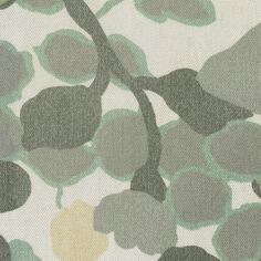 a close up view of a green and yellow wallpaper with leaves on white background