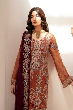 Brand: RamshaCollection: Rangoon Volume 12 Luxury Chiffon CollectionFabric: Chiffon PRODUCT DETAILS: Embroidered Chiffon front with sequins Embroidered Chiffon back Embroidered Chiffon sleeves Embroidered organza sleeves lace Embroidered organza ghera lace Embroidered Chiffon dupatta– 2.5 Yard Raw silk trouser – 2.5 Yard Embroidered organza trouser lace DISCLAIMER:* Lining, Laces, and Tassels are not included in unstitched variants.* Embellishment items in stitched outfits are subject to market availability.* The actual colors of the outfit may vary from the colors being displayed on your device. CARE INSTRUCTIONS: Extra Fabric Has Been Used For Shoot Original Color May Vary Slightly From The Picture Dry Clean Recommended Iron The Clothes At Moderate Temperature Do Not Use Bleach, Or Stain Batik Print Dress, Saree Sale, Lehenga Jewellery, Embellished Shirt, Organza Sleeves, Block Dress, Lehenga Style, Red Chiffon, Jamdani Saree