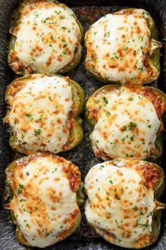 stuffed bell peppers with cheese and herbs in a baking dish, ready to be eaten