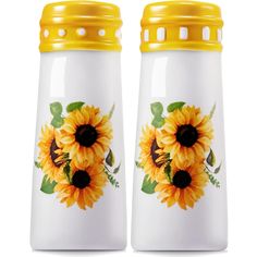 two ceramic salt and pepper shakers with sunflowers painted on the sides, one yellow