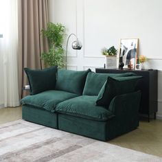 a living room with a large green couch