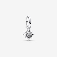 Bring a dash of cosmic energy to your look with the Pandora ME Star Mini Dangle Charm. This sterling silver eight-pointed star features five sparkling stones and microbeads on one side, with a microbead pattern on the reverse side. As a symbol of renewal, dreams and a guiding light, this star can take on any meaning you or a loved one gives it. Can only be styled on openable links. - Pandora ME Star Mini Dangle Charm - Sterling silver / Cubic Zirconia / Clear Pandora Star Jewelry, Star Pandora Charm, Pandora Moon Charm, Charms Disney, Pandora Compass Charm, Pandora Star, Pearl Diamond Jewelry, Pandora Essence, Custom Charm Bracelet