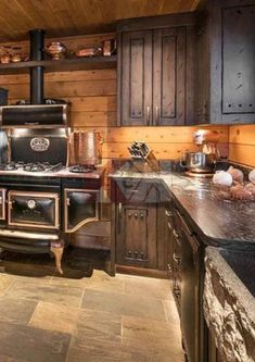 an old fashioned stove and oven in a rustic kitchen