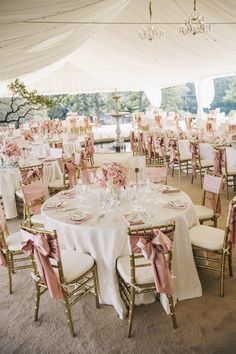 tables and chairs are set up for a wedding reception