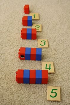 the numbers are lined up on the floor to make a number line that is made out of legos