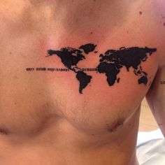 a man's chest with a world map tattoo on his chest and words written across the chest