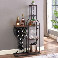 a wine rack with bottles and glasses on it