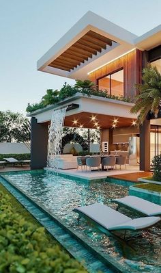 a modern house with a pool and lounge chairs