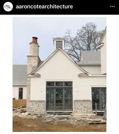 an image of a house being built in the process of being remodeled with stone and brick