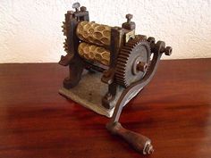 an old mechanical clock on a wooden table