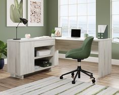 an office with a desk, chair and computer on the table in front of a window