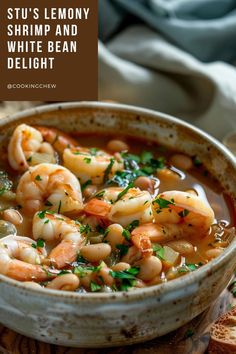 A white bowl filled with lemony shrimp and white bean soup sits on a wooden table. Shrimp And White Bean Stew, Lemony Shrimp And White Bean Stew, New York Times Lemony Shrimp And Bean Stew, Frozen Shrimp Recipes, Shrimp Stew, Dinner Today