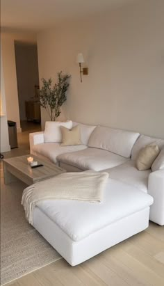 a large white couch sitting in a living room