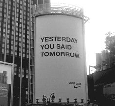 an advertisement on the side of a water tower for nike in new york city's times square