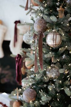 a christmas tree with ornaments hanging from it