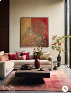 a living room filled with lots of furniture next to a large painting on the wall