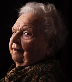 an old woman with white hair and blue eyes