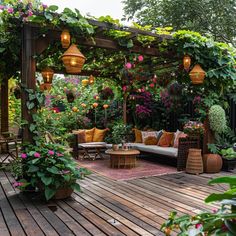 an outdoor living area with lots of plants