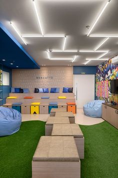 an office with artificial grass and couches