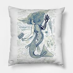 a pillow with an image of a mermaid holding a guitar in her hand and writing on it