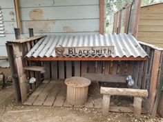 an old wooden building with a sign on it