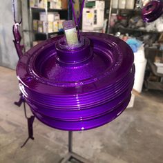 a large purple object on a metal stand