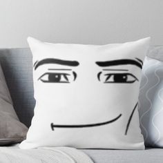 a pillow with a face drawn on it