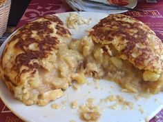 a white plate topped with food on top of a table