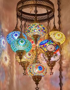 a chandelier with many colorful lights hanging from it