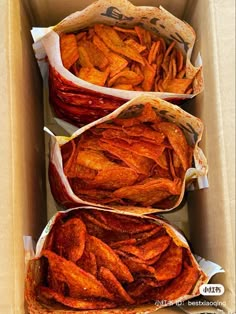 three baskets filled with food sitting inside of a box