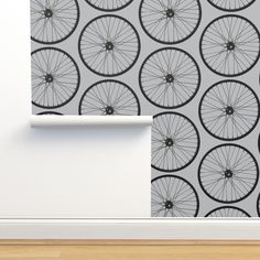 a wall with a bicycle wheel pattern on it