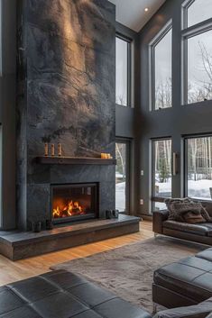 a modern living room with large windows and a fireplace