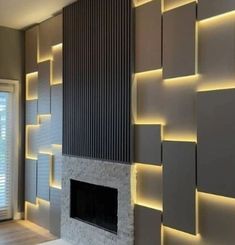 a living room with a fire place next to a wall covered in bookshelves