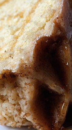 a close up view of some food on a white plate with brown stuff in the middle