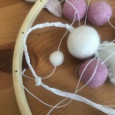 some balls and yarn are on a table