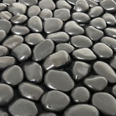 a close up view of some black and white pebbles