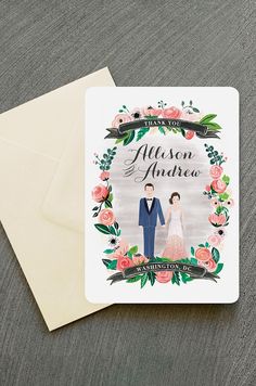 a wedding card with an image of the bride and groom in floral wreaths on it