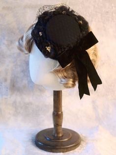 Handmade Black Bowknot Floral Design Veil Mini Hat Handmade Black Mini Hat With Short Brim, Adjustable Round Crown Hat For Evening, Black Hat With Bow And Curved Brim, Adjustable Evening Hat With Round Crown, Kentucky Derby Black Hat With Bow, Black Brimmed Hat With Bow, Elegant Black Adjustable Bonnet, Elegant Adjustable Black Bonnet, Vintage Black Handmade Top Hat