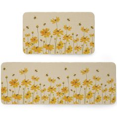 two placemats with yellow flowers and bees on them, one in front of the other