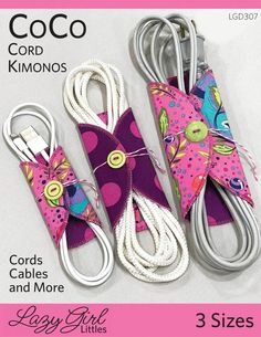 three pieces of cord with different patterns and colors on them, one has a pink flower