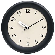 a black and white clock with numbers on the face is shown in front of a white background