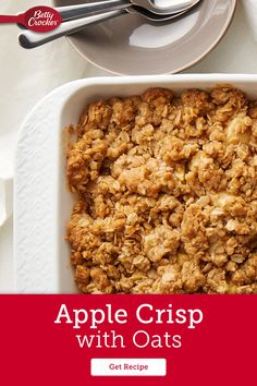 an apple crisp with oats in a casserole dish on a white table