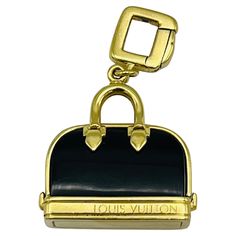 Product details: The charm is designed by Louis Vuitton, it is made out of 18K yellow gold and black enamel. Vintage Louis Vuitton, Purse Charms, Gold Enamel, Black Enamel, Jewellery And Watches, Making Out, Bottle Opener, Jewelry Watches, Louis Vuitton