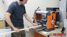 a man working on a machine in a shop