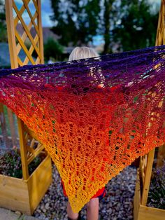 "Skull shawl//ombré shawl//cotton shawl scarf This beautiful crocheted skull shawl is made from cotton with a bit of sparkle weaved in.  It blends from yellow to deep purple making the skulls really pop. As you can see from my lovely 9yr old model, that it is quite large! So it's ideal as a shawl to wrap around you on a cool evening, or you can gather it around your neck in the winter to keep you cosy!  One thing for sure, is that you will have people admiring how gorgeous it is!  It is lovingly Lost Souls Shawl, Skull Shawl, Ombre Shawl, Crochet Blanket Colors, Cotton Shawl, Skull Gifts, Lost Souls, Skull Clothing, Lost Soul