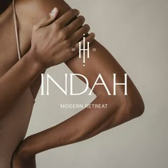 a woman's arm with the words inddah on it