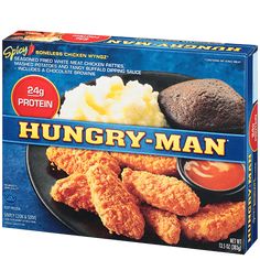 a box of hungry man fried chicken with potatoes and gravy on the side