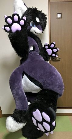 a large stuffed animal sitting on top of a floor