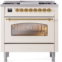 an old fashioned oven with gold knobs on the front and side doors, sitting against a white background