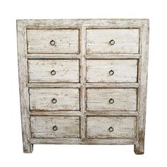 an old white dresser with six drawers